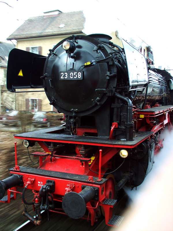 23058